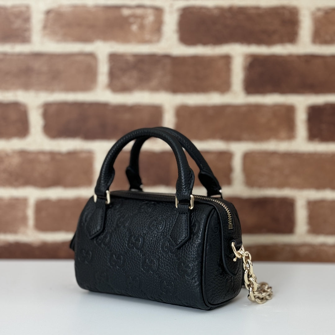 GUCCI GG Emblem medium boston bag in Black Leather