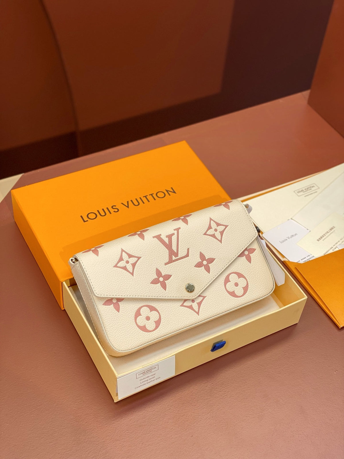 Louis Vuitton Félicie Pochette in black and beige Bicolor
