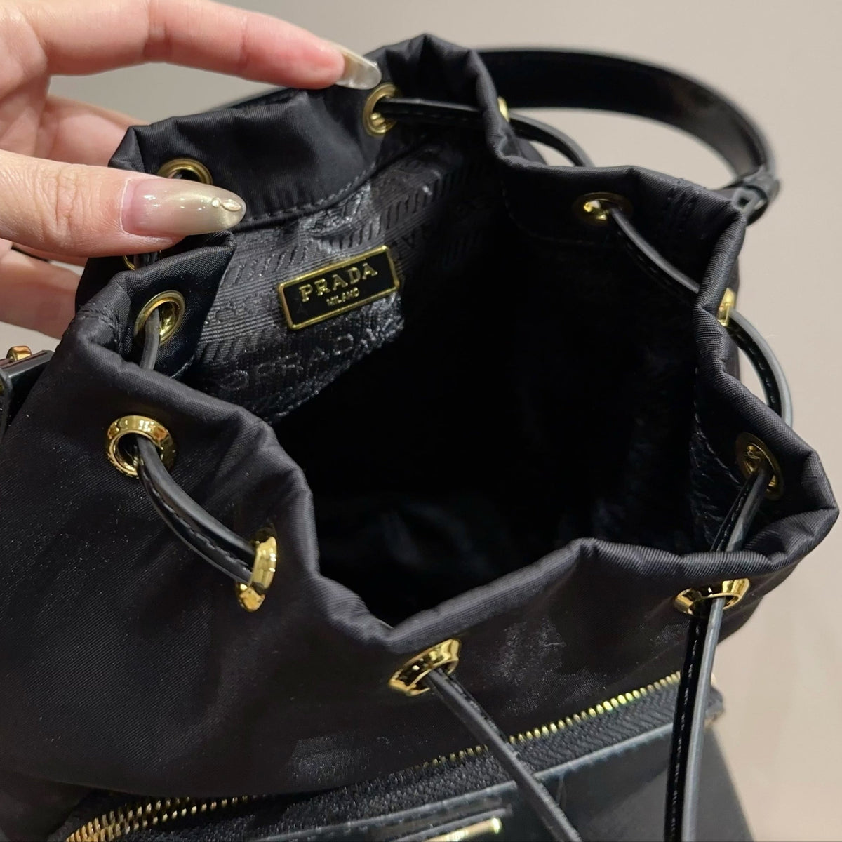 BUCKET BAG 22 IN BLACK RE-NYLON AND CALFSKIN HANDLE