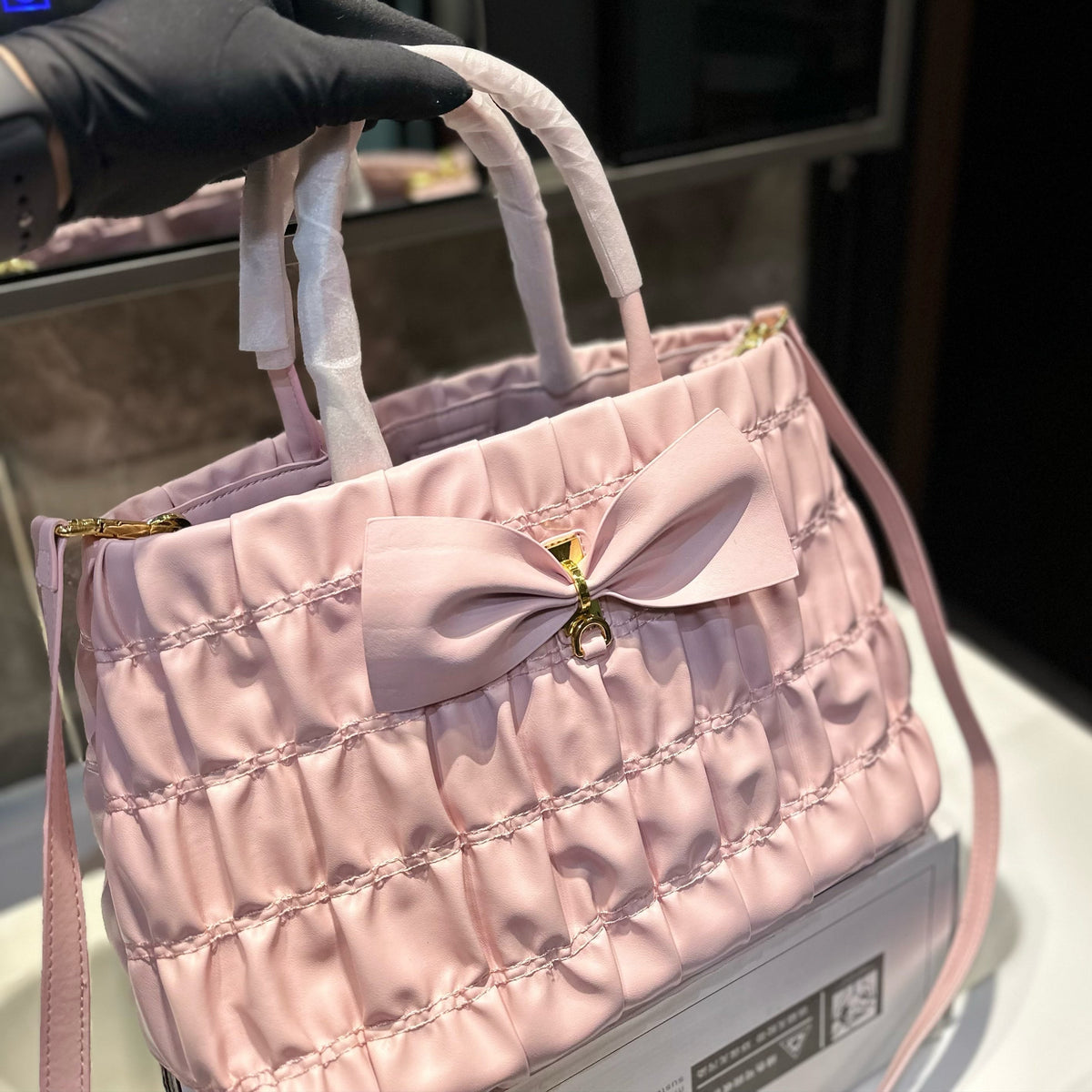 BOW DETAIL RUCHED TOP HANDLE BAG 29 IN LIGHT PINK SAFFIANO LEATHER