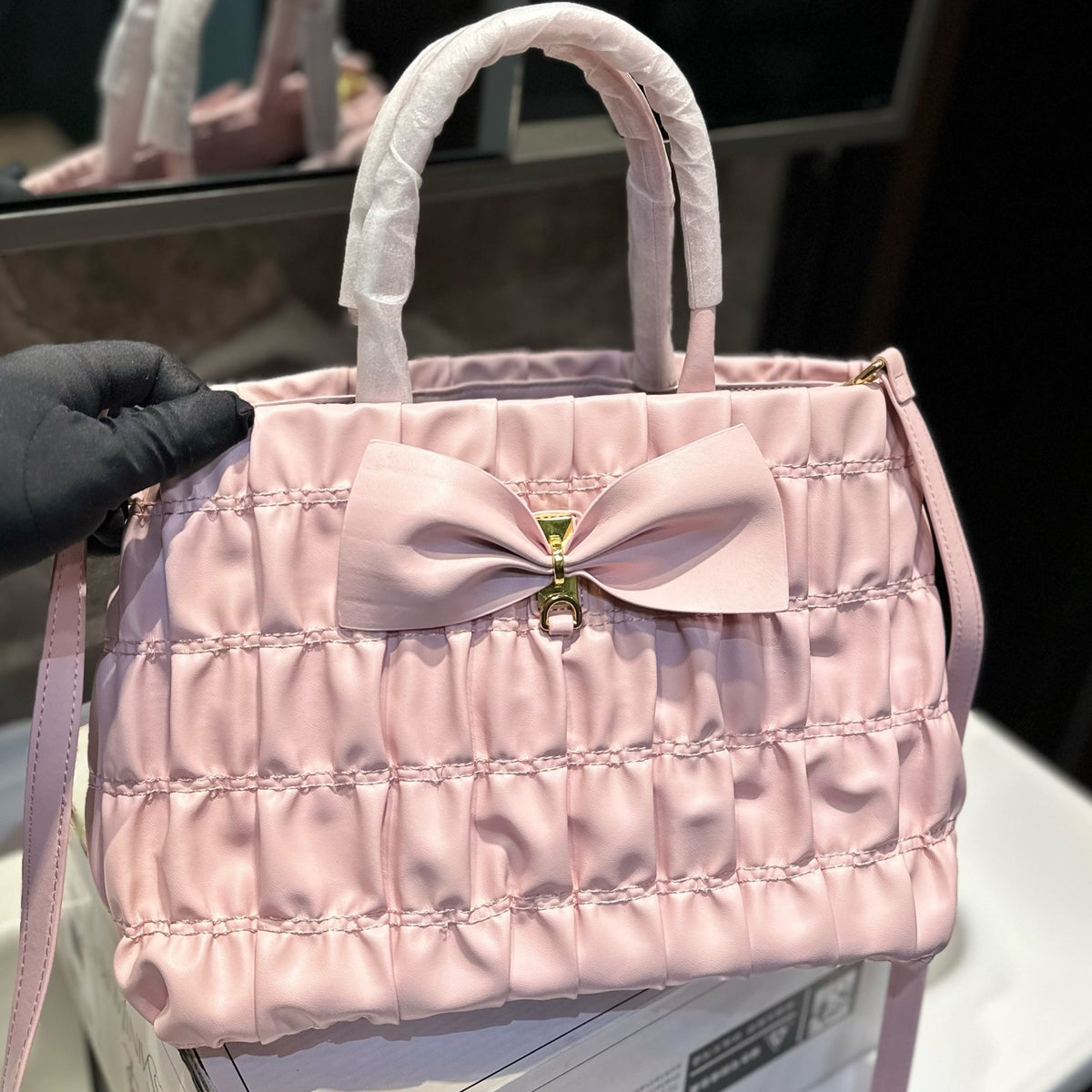 BOW DETAIL RUCHED TOP HANDLE BAG 29 IN LIGHT PINK SAFFIANO LEATHER