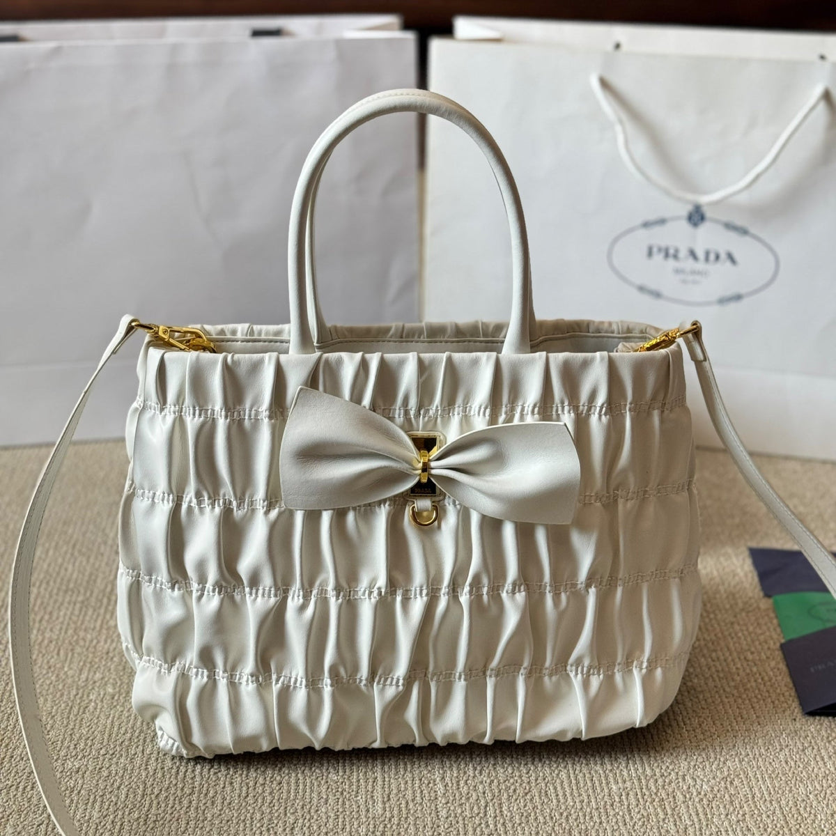 BOW DETAIL RUCHED TOP HANDLE BAG 28 IN WHITE SAFFIANO LEATHER