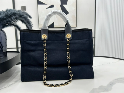 CHANEL DEAUVILLE LARGE 38 TOTE BAG IN BLACK CANVAS WITH GOLD EMBROIDERED LOGO