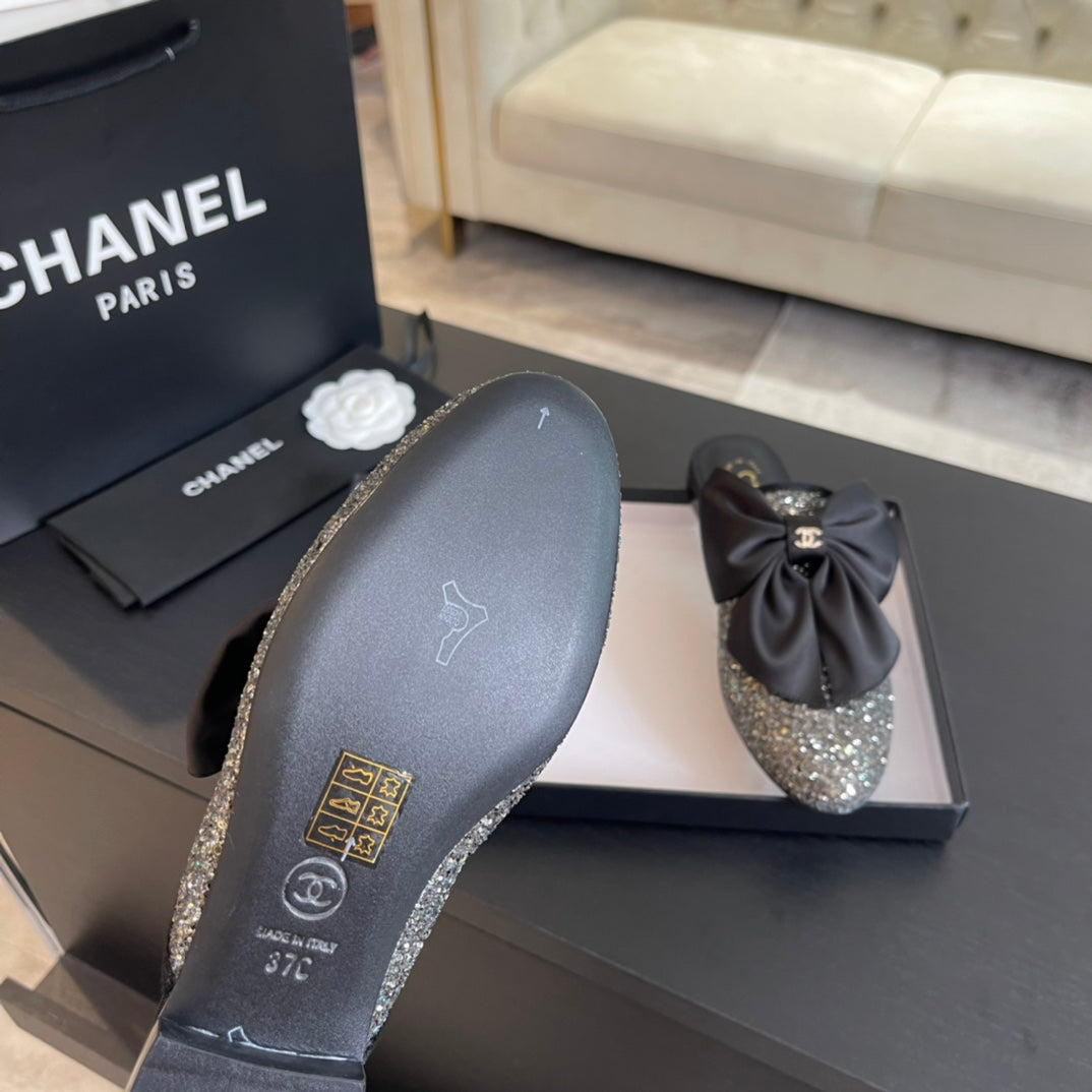 BIG BOW FLAT MULE SANDALS IN BLACK SILK WITH GLITTER SEQUINS