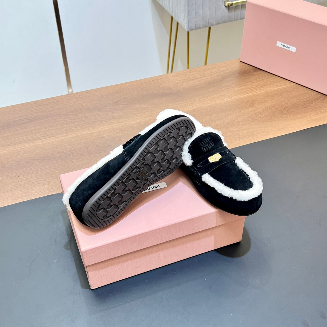 LOAFERS IN BLACK SUEDE AND WHITE SHEARLING TRIM