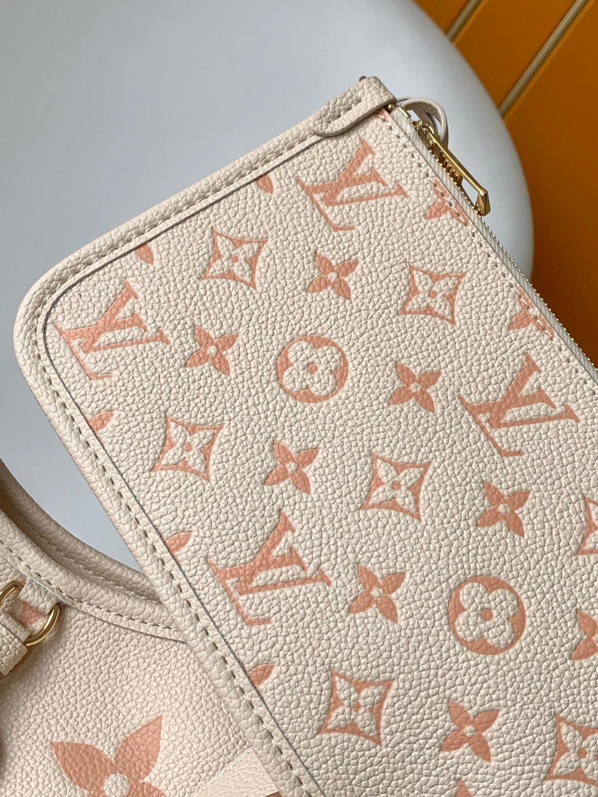 CARRYALL PM 29 BAG IN BEIGE MIX PINK MONOGRAM EMPREINTE LEATHER
