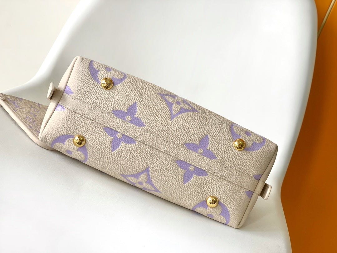 CARRYALL PM 29 BAG IN BEIGE MIX PURPLE MONOGRAM EMPREINTE LEATHER