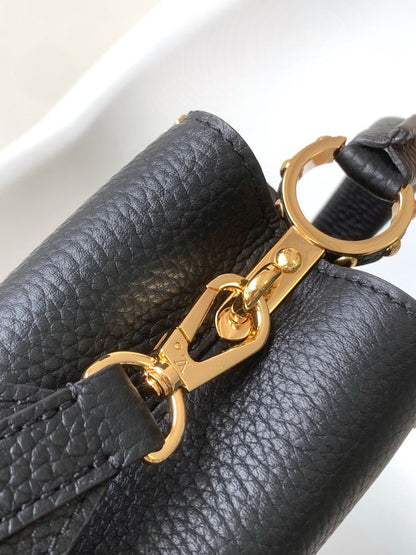 CAPUCINES MM BAG 21 IN BLACK TAURILLON COWHIDE GOLD HARDWARE