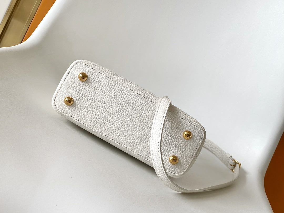 CAPUCINES EAST-WEST MINI 21 IN WHITE TAURILLON LEATHER GOLD-TONE HARDWARE