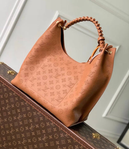 Louis Vuitton Carmel Mahina Leather Hobo Bag in Cognac