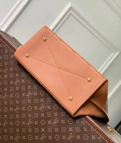 Louis Vuitton Carmel Mahina Leather Hobo Bag in Cognac