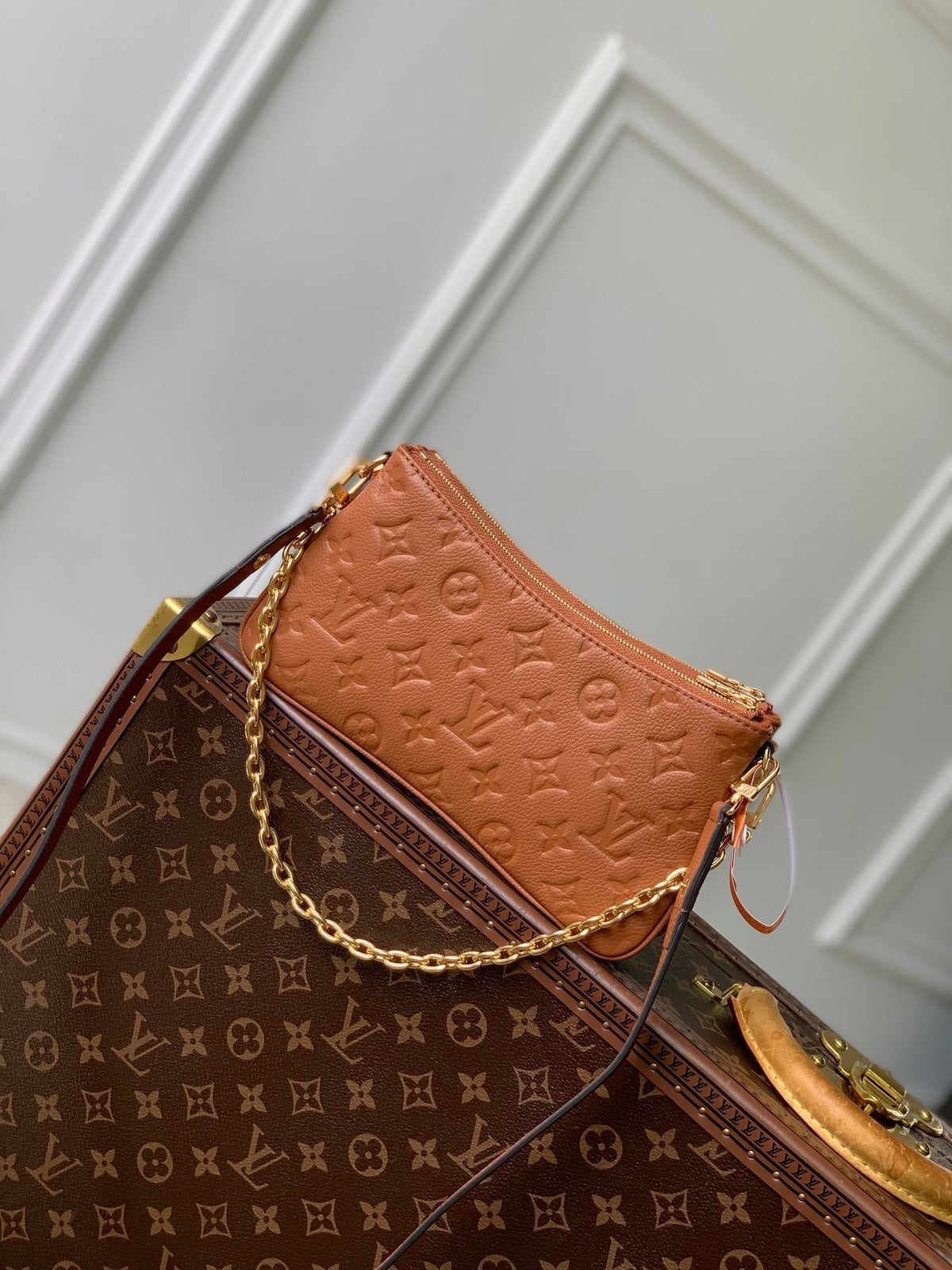 LIV POCHETTE BAG 24 IN COGNAC BROWN MONOGRAM EMPREINTE LEATHER