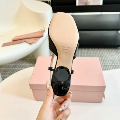 Black High Heels With Silver Bow