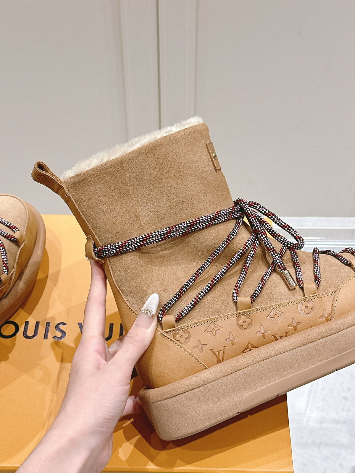 ASPEN PLATFORM ANKLE BOOT IN CIDER BROWN MONOGRAM DEBOSSED SUEDE AND SHEARLING