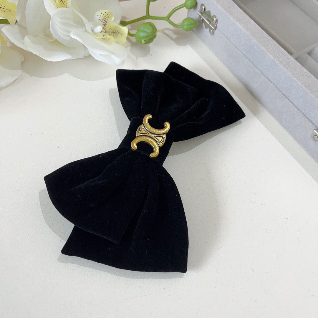 BLACK VELVET WITH GOLD LOGO HAIRPIN 387059