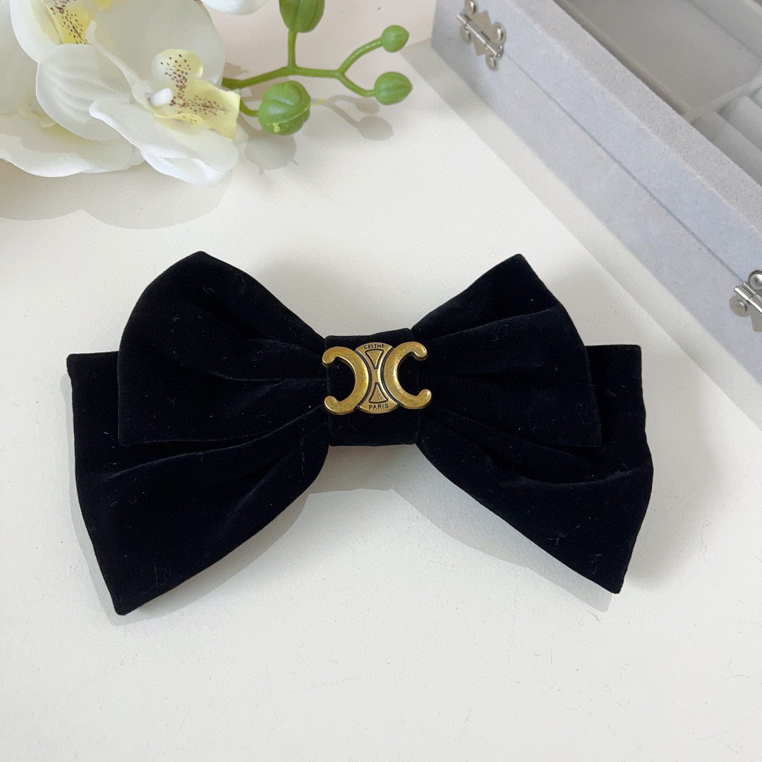 BLACK VELVET WITH GOLD LOGO HAIRPIN 387059