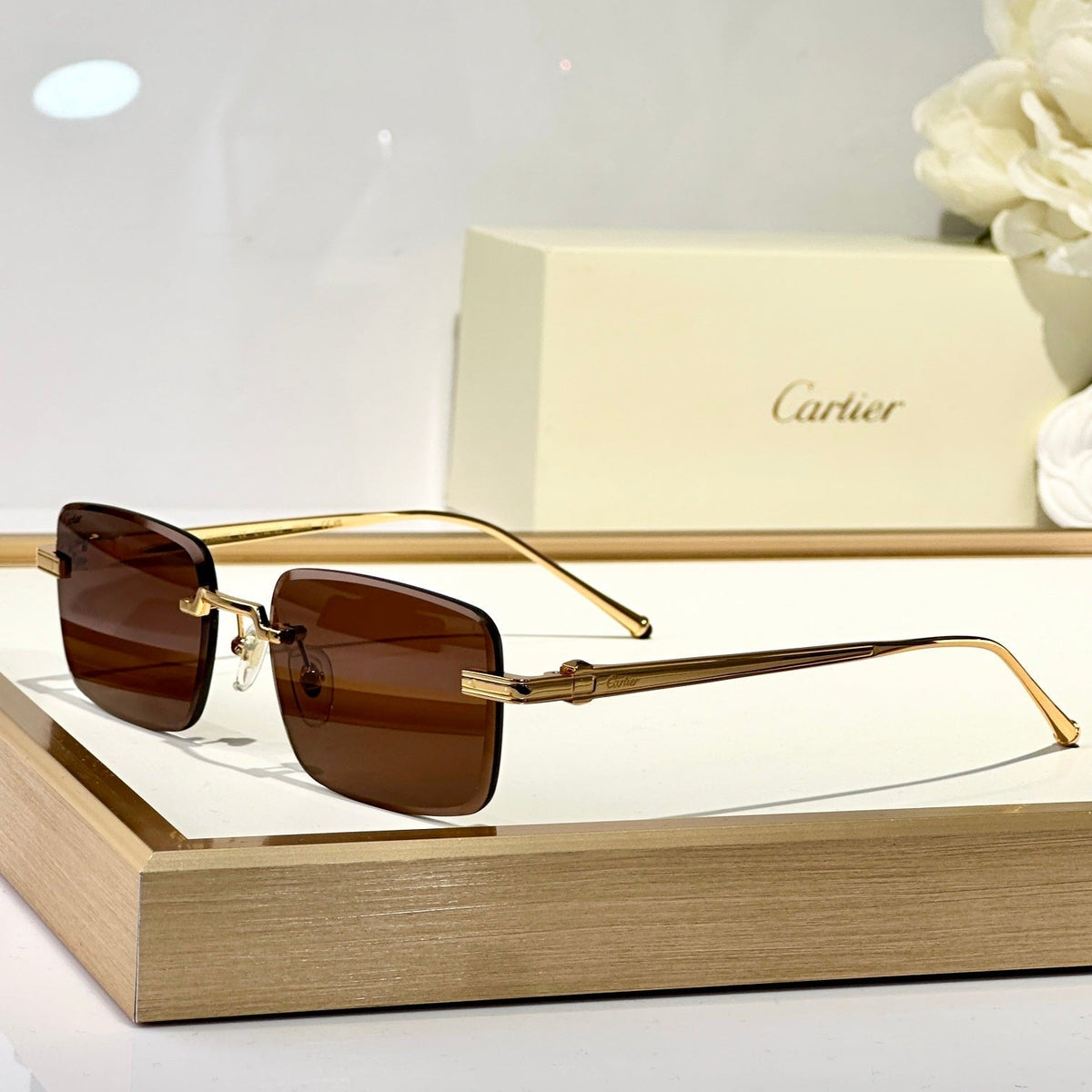 C DE RIMLESS SQUARE FRAME SUNGLASSES CT0610S IN METAL