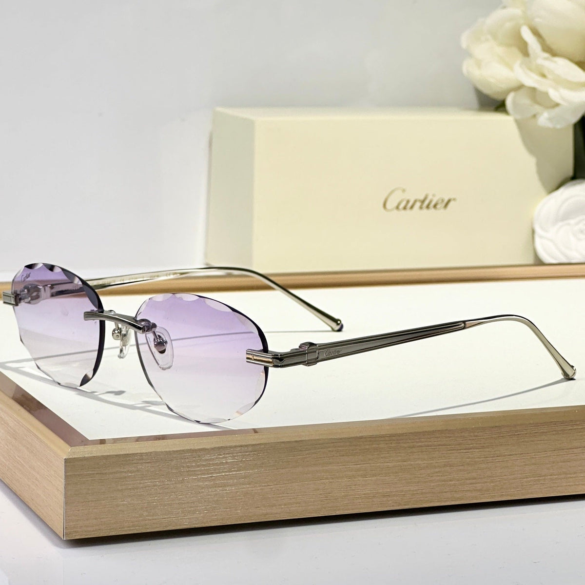 C DE RIMLESS ROUND FRAME SUNGLASSES CT0611S IN METAL