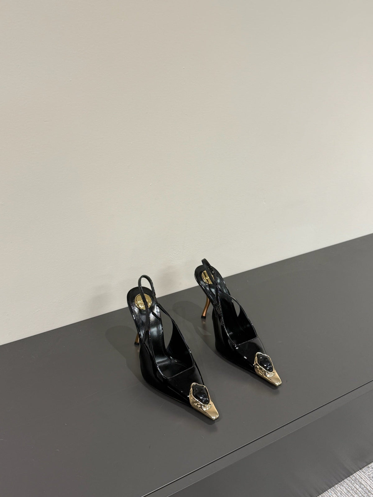 BLACK GEM-STUDDED SLINGBACK PUMPS IN BLACK PATENT CALFSKIN