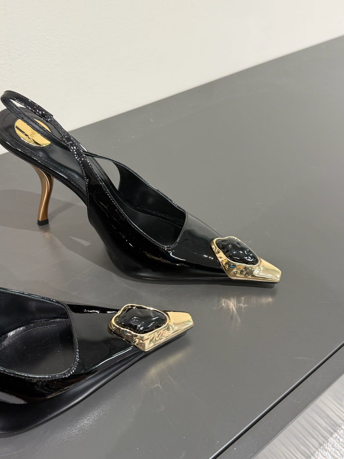 BLACK GEM-STUDDED SLINGBACK PUMPS IN BLACK PATENT CALFSKIN