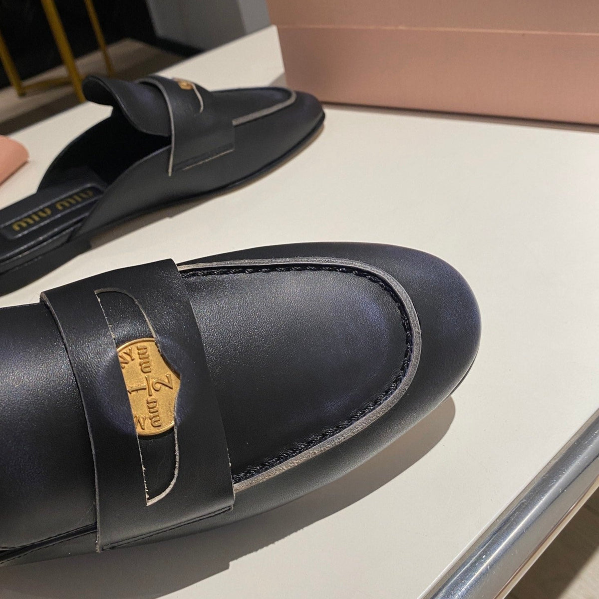 MULES SLIPPERS BLACK COWHIDE WITH GOLD COIN