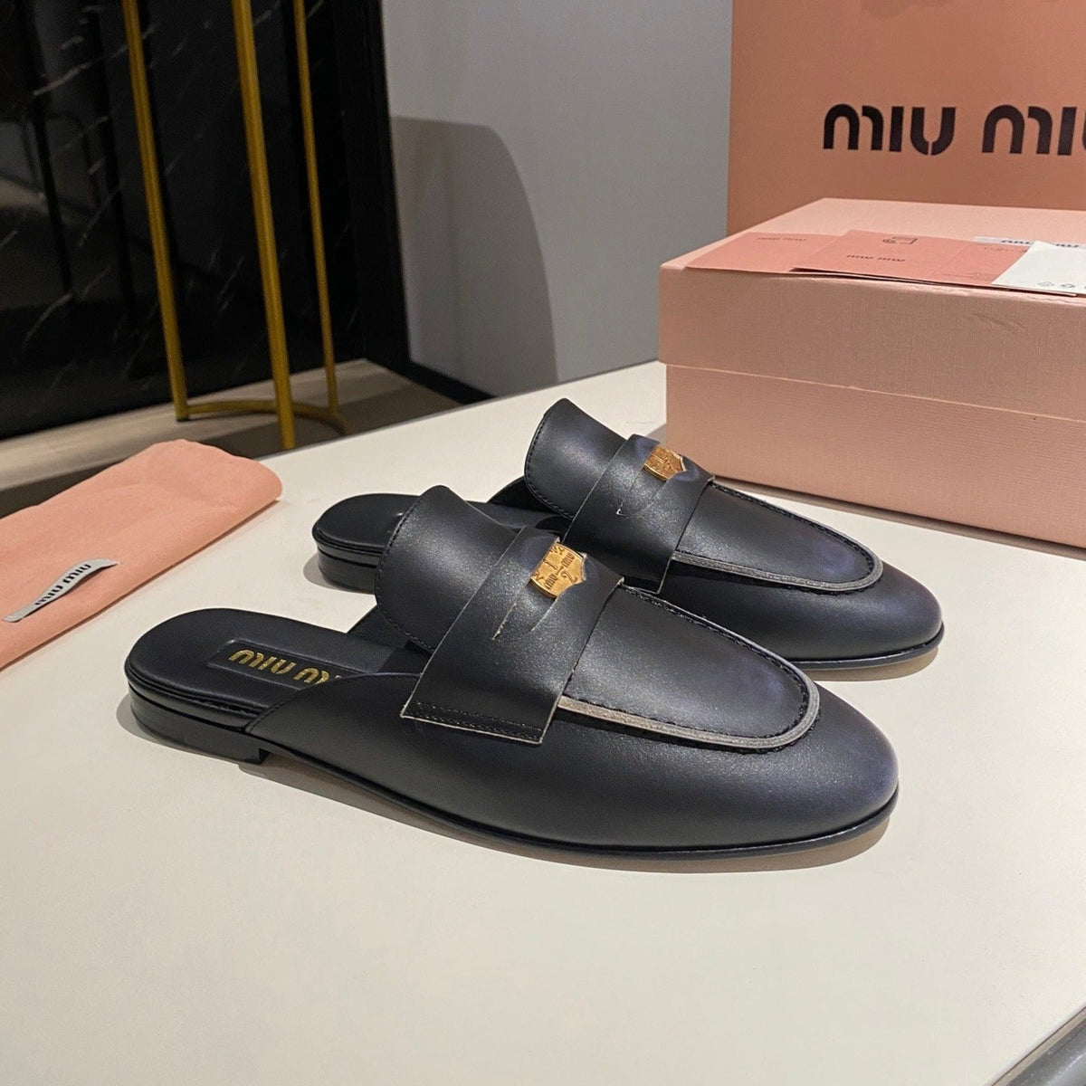 MULES SLIPPERS BLACK COWHIDE WITH GOLD COIN