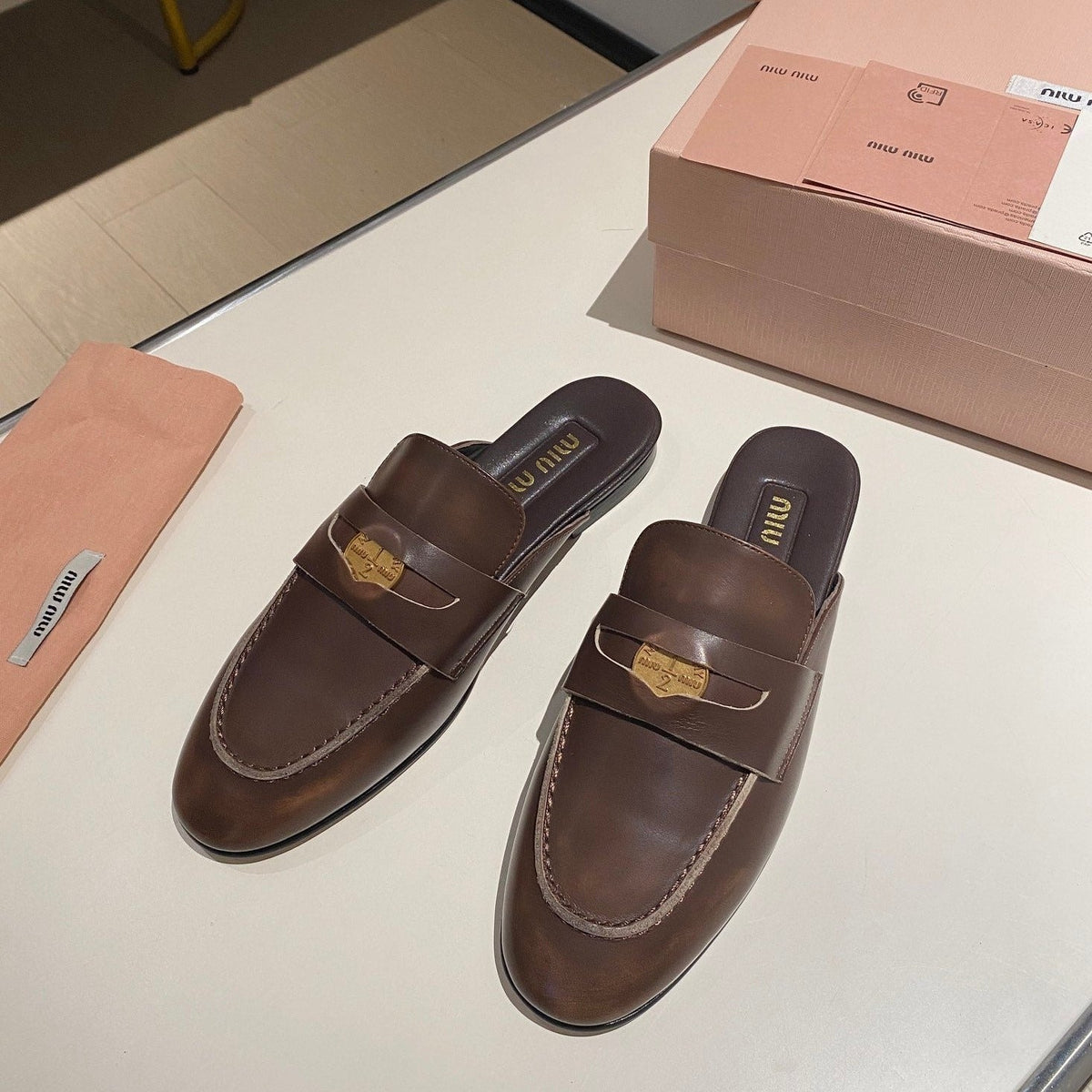 MULES SLIPPERS CHOCOLATE COLOR COWHIDE WITH GOLD COIN