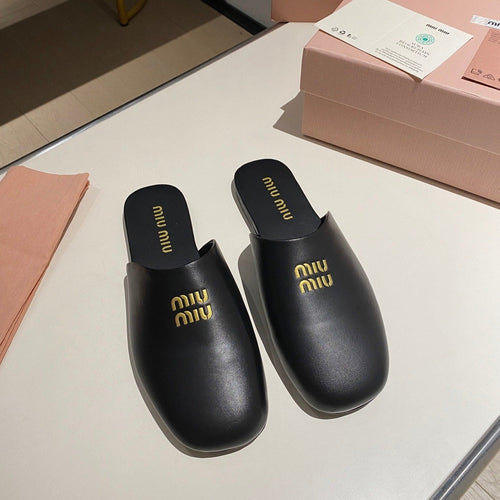 MULES SLIPPERS RETRO BLACK COWHIDE