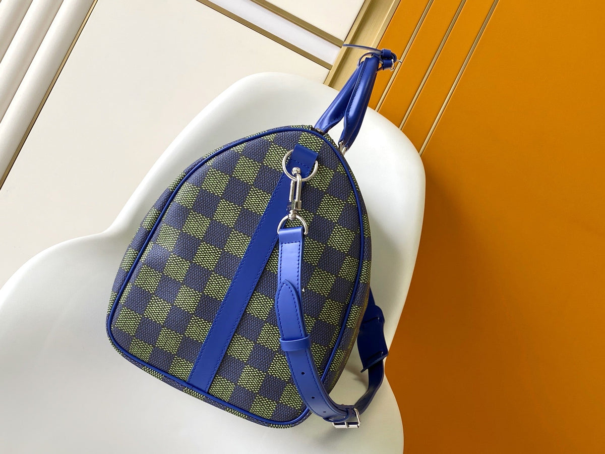 KEEPALL BANDOULIÈRE 50 IN BLUE GREEN DAMIER HERITAGE COATED CANVAS