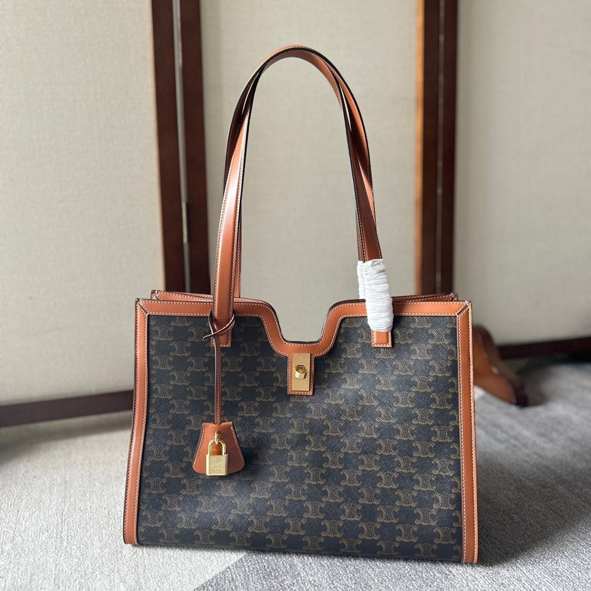 CABAS 37 IN BLACK TRIOMPHE CANVAS AND BRONZE BROWN CALFSKIN TRIM GOLD LOCK