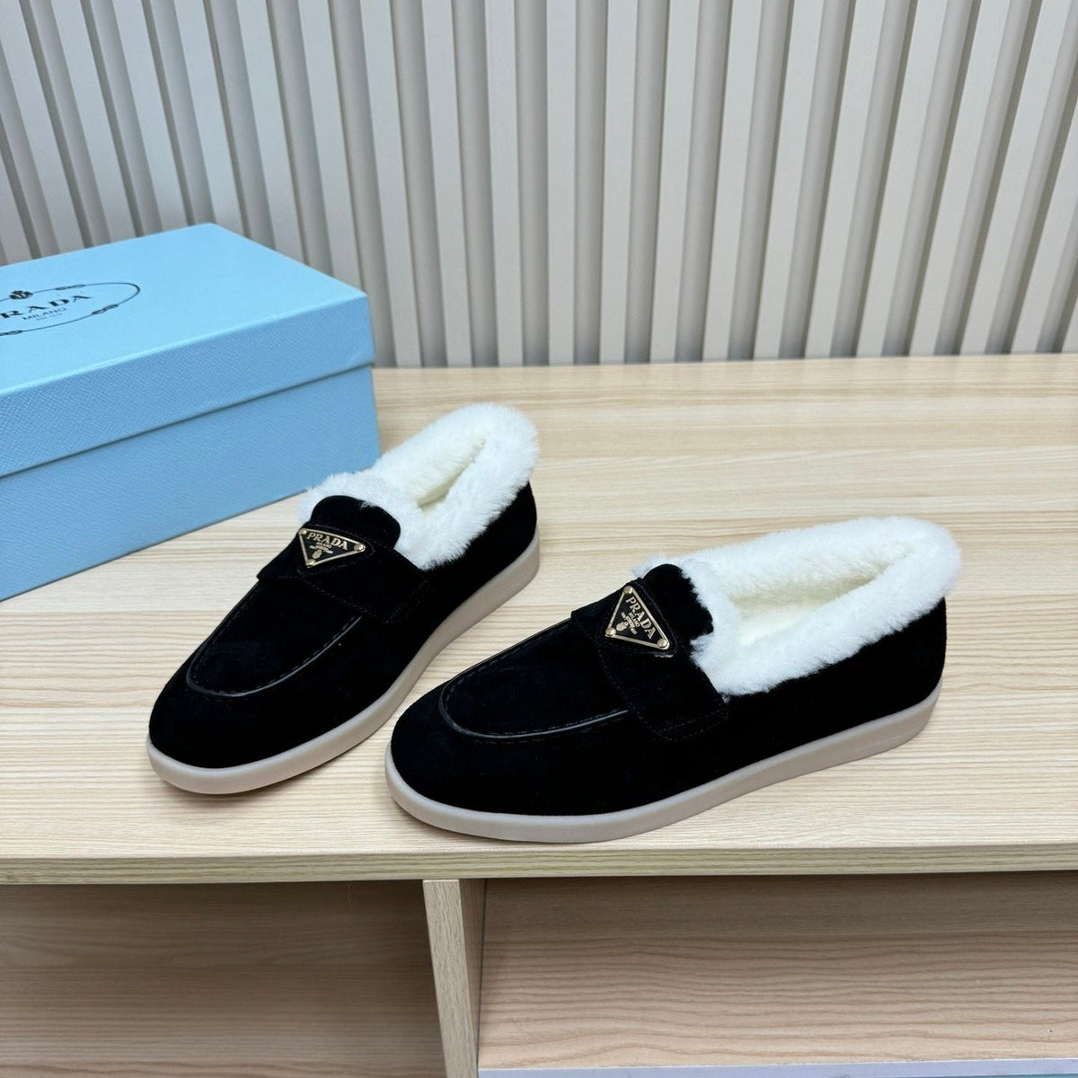 LOAFER IN BLACK SUEDE AND FUR LINING ATTACHED TRIANGLE LOGO