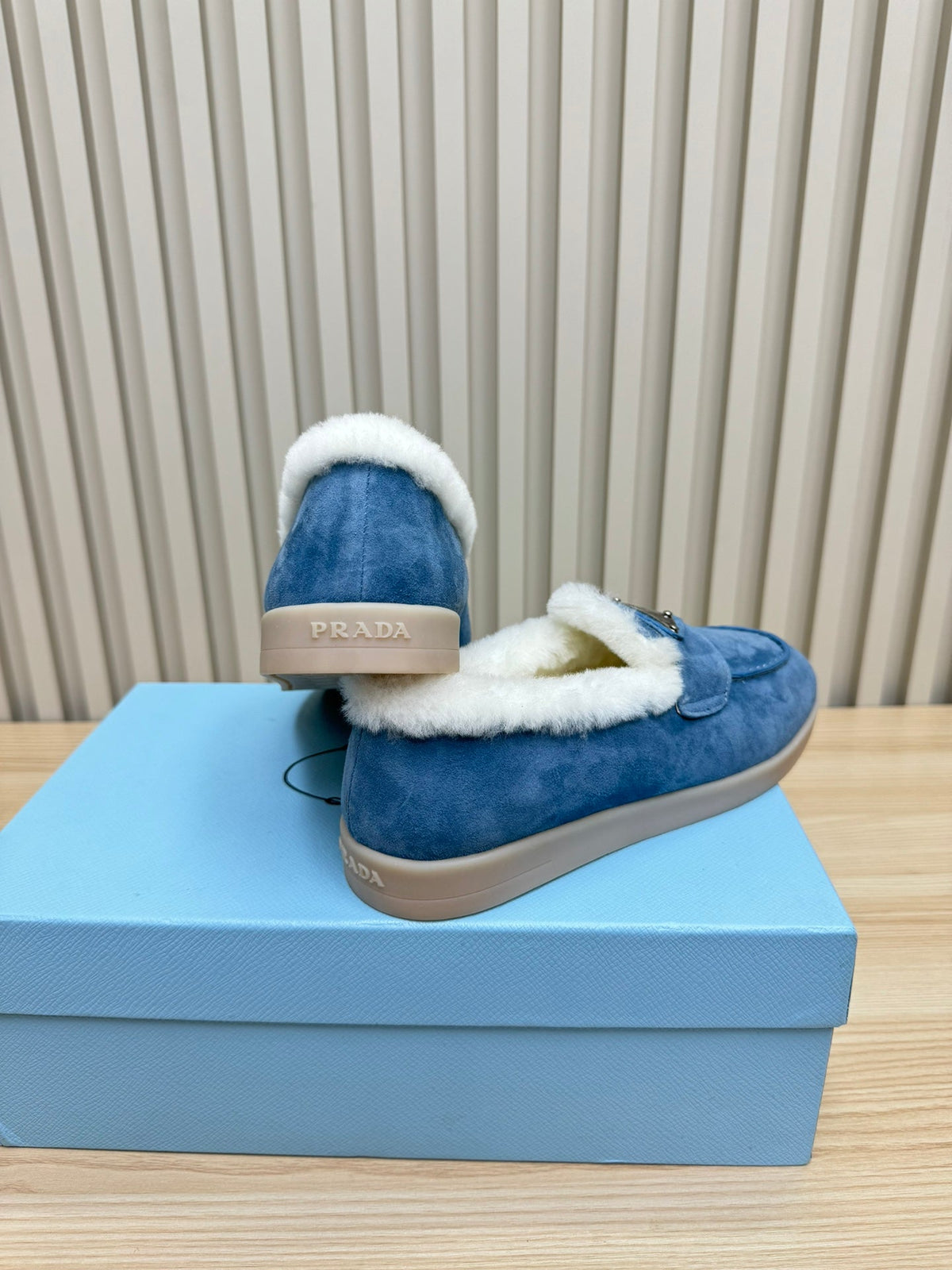 LOAFER IN AZURE BLUE SUEDE AND FUR LINING ATTACHED TRIANGLE LOGO
