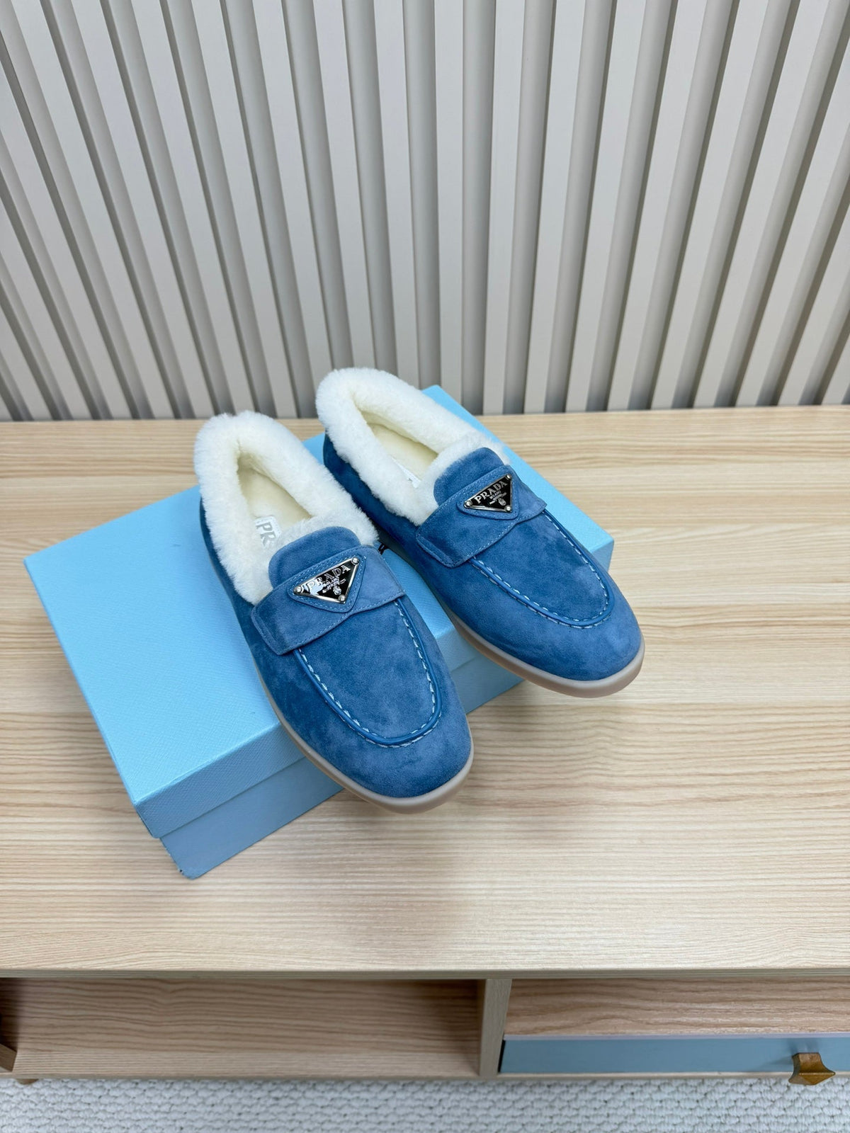 LOAFER IN AZURE BLUE SUEDE AND FUR LINING ATTACHED TRIANGLE LOGO