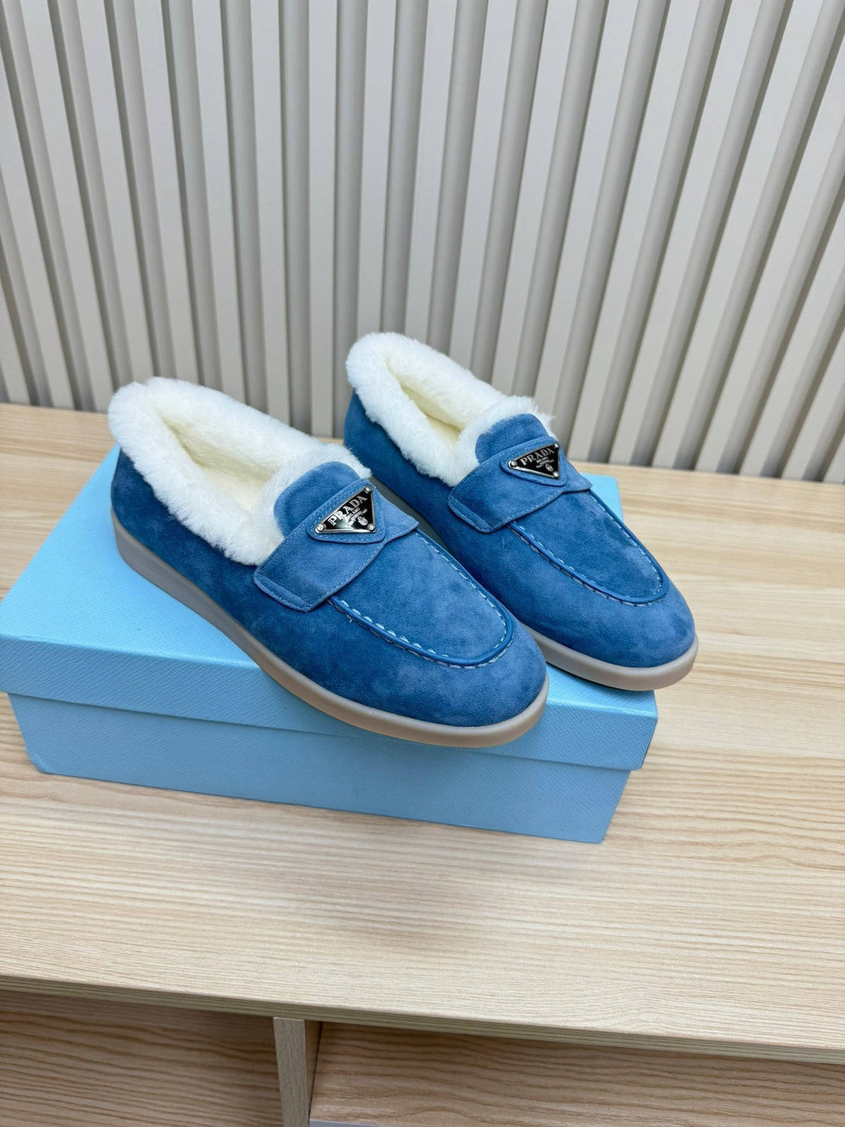 LOAFER IN AZURE BLUE SUEDE AND FUR LINING ATTACHED TRIANGLE LOGO