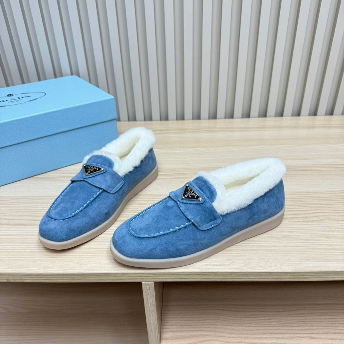 LOAFER IN AZURE BLUE SUEDE AND FUR LINING ATTACHED TRIANGLE LOGO
