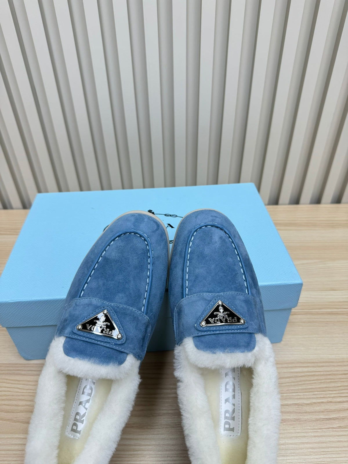 LOAFER IN AZURE BLUE SUEDE AND FUR LINING ATTACHED TRIANGLE LOGO