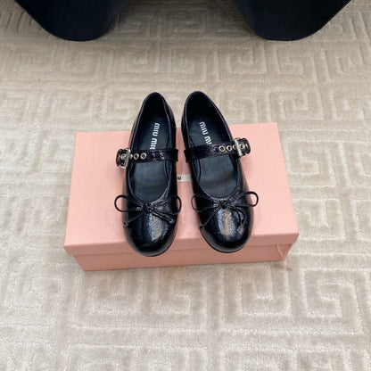 BOW MARY JANE FLAT IN BLACK NAPLAK LAMBSKIN