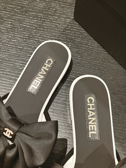 BOW LADY SLIPPERS BLACK LAMBSKIN WITH WHITE RHINESTONES