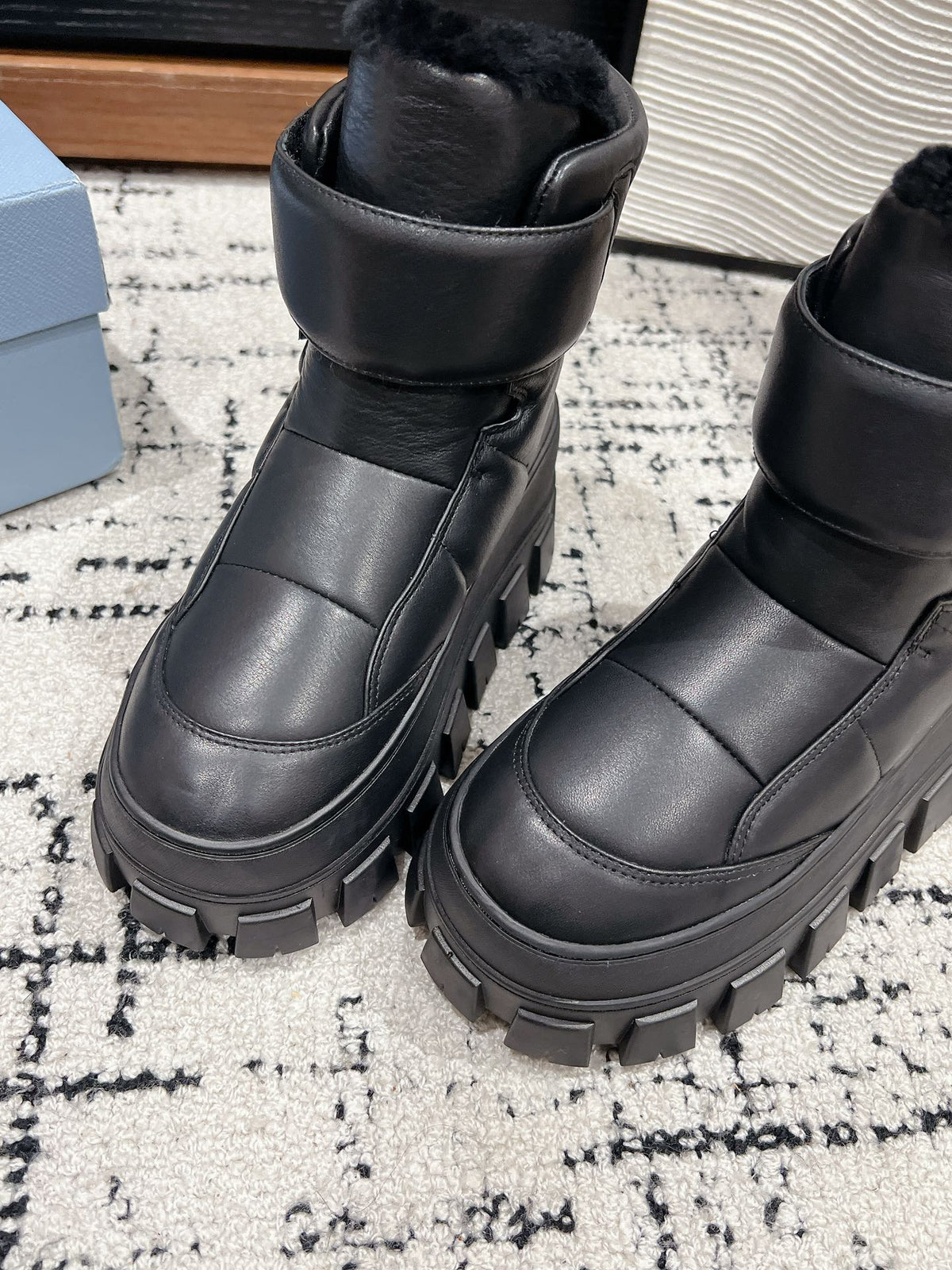 MONOLITH ANKLE BOOTS WITH STRAP IN BLACK CALFSKIN AND FLEECE LINING