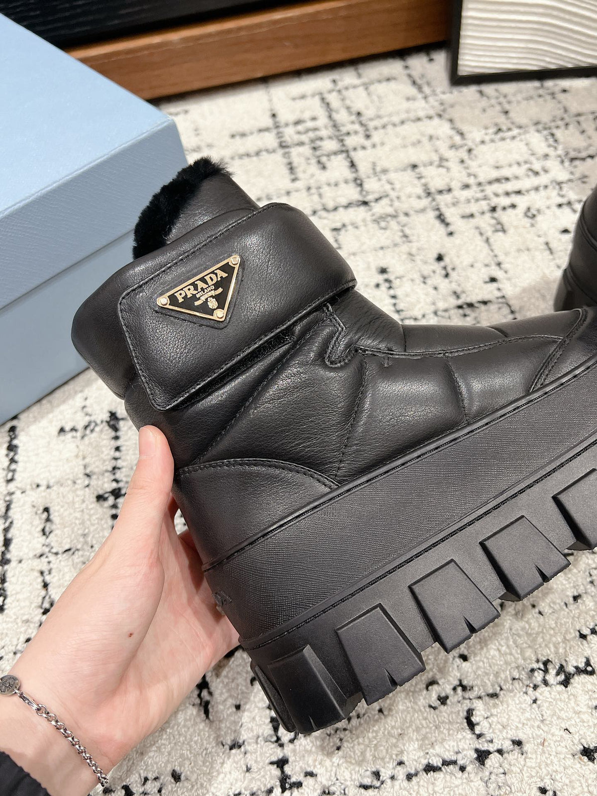 MONOLITH ANKLE BOOTS WITH STRAP IN BLACK CALFSKIN AND FLEECE LINING