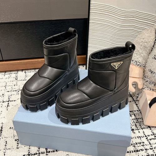 MONOLITH ANKLE BOOTS IN BLACK CALFSKIN AND LAMB FUR LINING