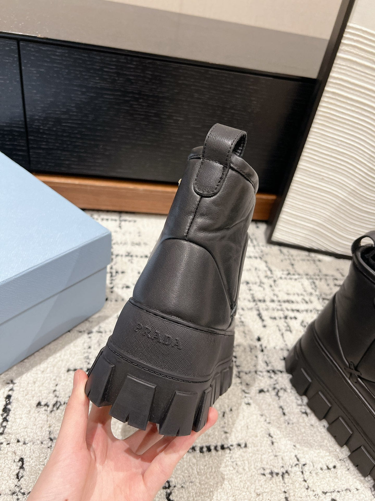 MONOLITH ANKLE BOOTS IN BLACK CALFSKIN AND LAMB FUR LINING