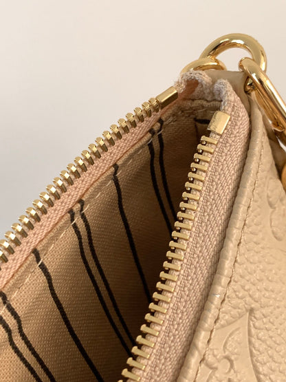 LV EASY POUCH ON STRAP 19 IN BEIGE MONOGRAM EMPREINTE LEATHER