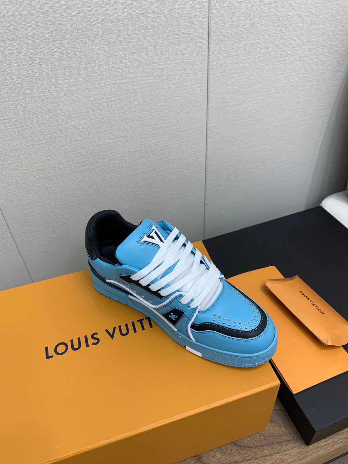 LV WOMEN'S TRAINER IN CERULEAN BLUE CALFSKIN