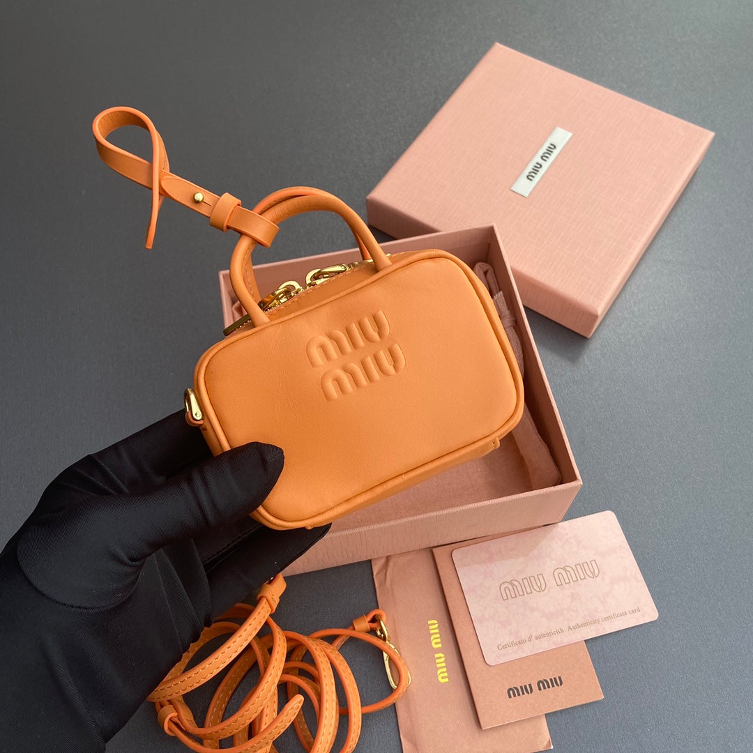 MICRO BAG KEYCHAIN 11 IN HOT CINNAMON ORANGE CALFSKIN EMBOSSED LOGO
