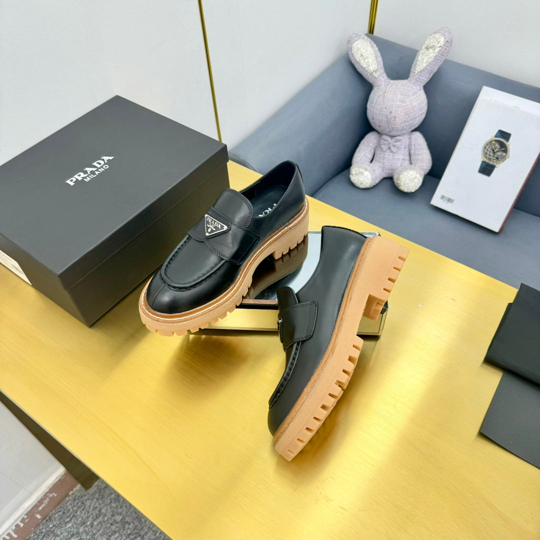 LOAFER WITH TRIANGLE LOGO IN BLACK CALFSKIN