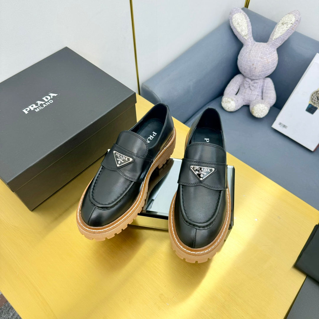 LOAFER WITH TRIANGLE LOGO IN BLACK CALFSKIN