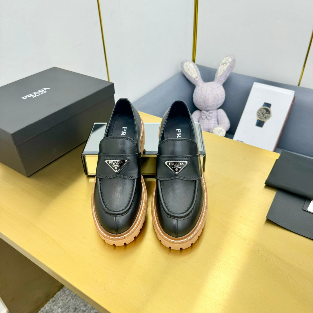 LOAFER WITH TRIANGLE LOGO IN BLACK CALFSKIN