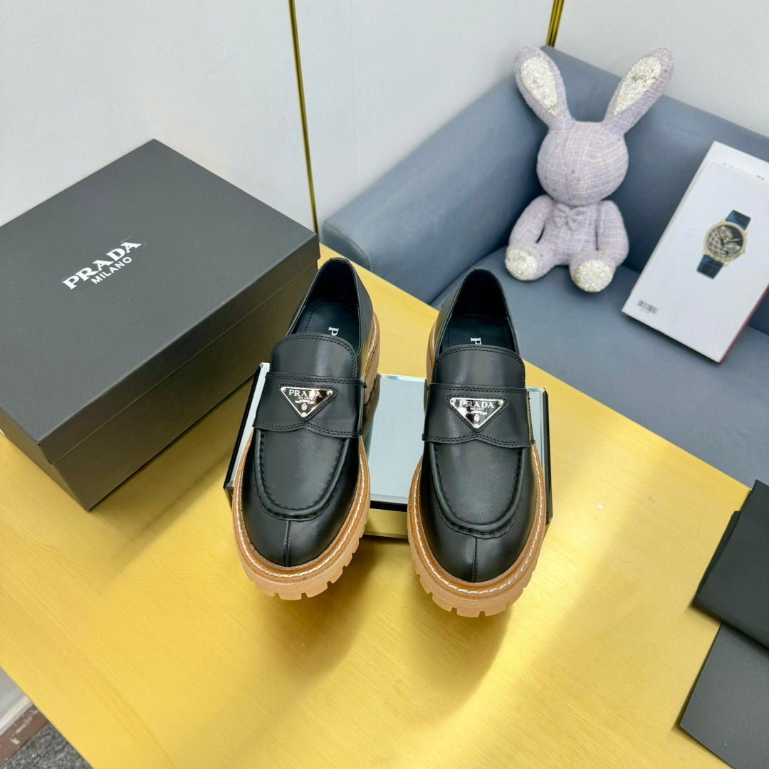 LOAFER WITH TRIANGLE LOGO IN BLACK CALFSKIN