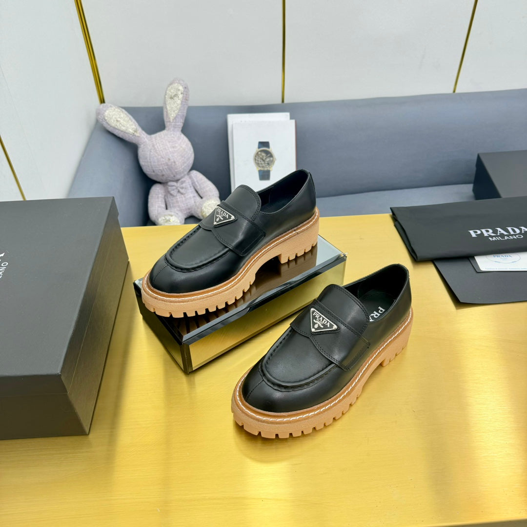 LOAFER WITH TRIANGLE LOGO IN BLACK CALFSKIN